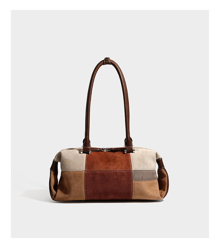 Patchwork suede-look barrel shoulder bag in brown, rust, tan, beige, and gray panels with double leather-look straps and