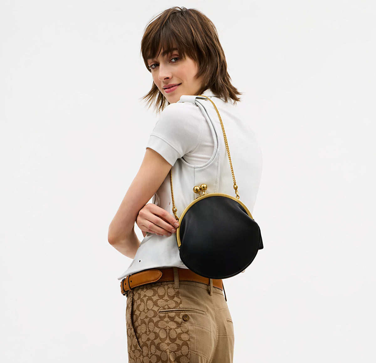 Runde Clutch mit Kiss-Lock-Verschluss, goldfarbenem Rahmen und Kugelknöpfen, Detailansicht 16