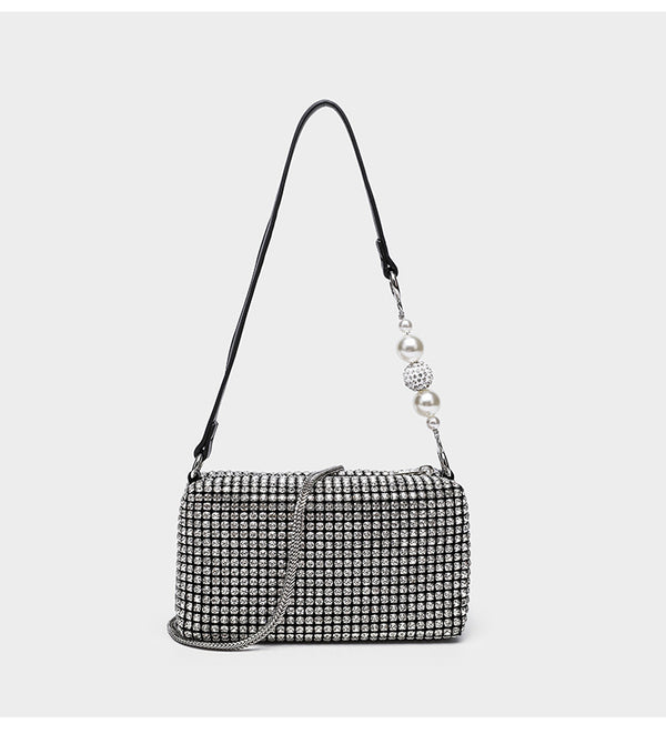 Small rectangular all-over rhinestone crossbody bag with pearl bead zipper pull and detachable silver chain strap, detail