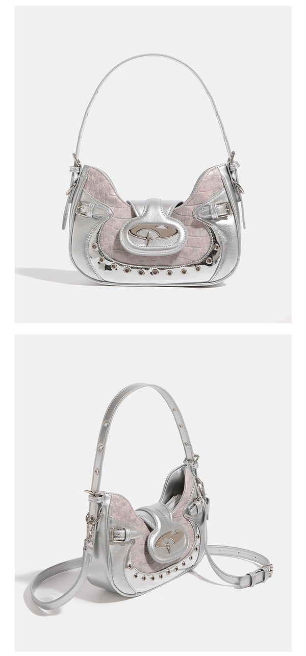 Compact croc-embossed leather-look shoulder bag with silver grommet trim, buckle strap detail, and four-point star turn-lock