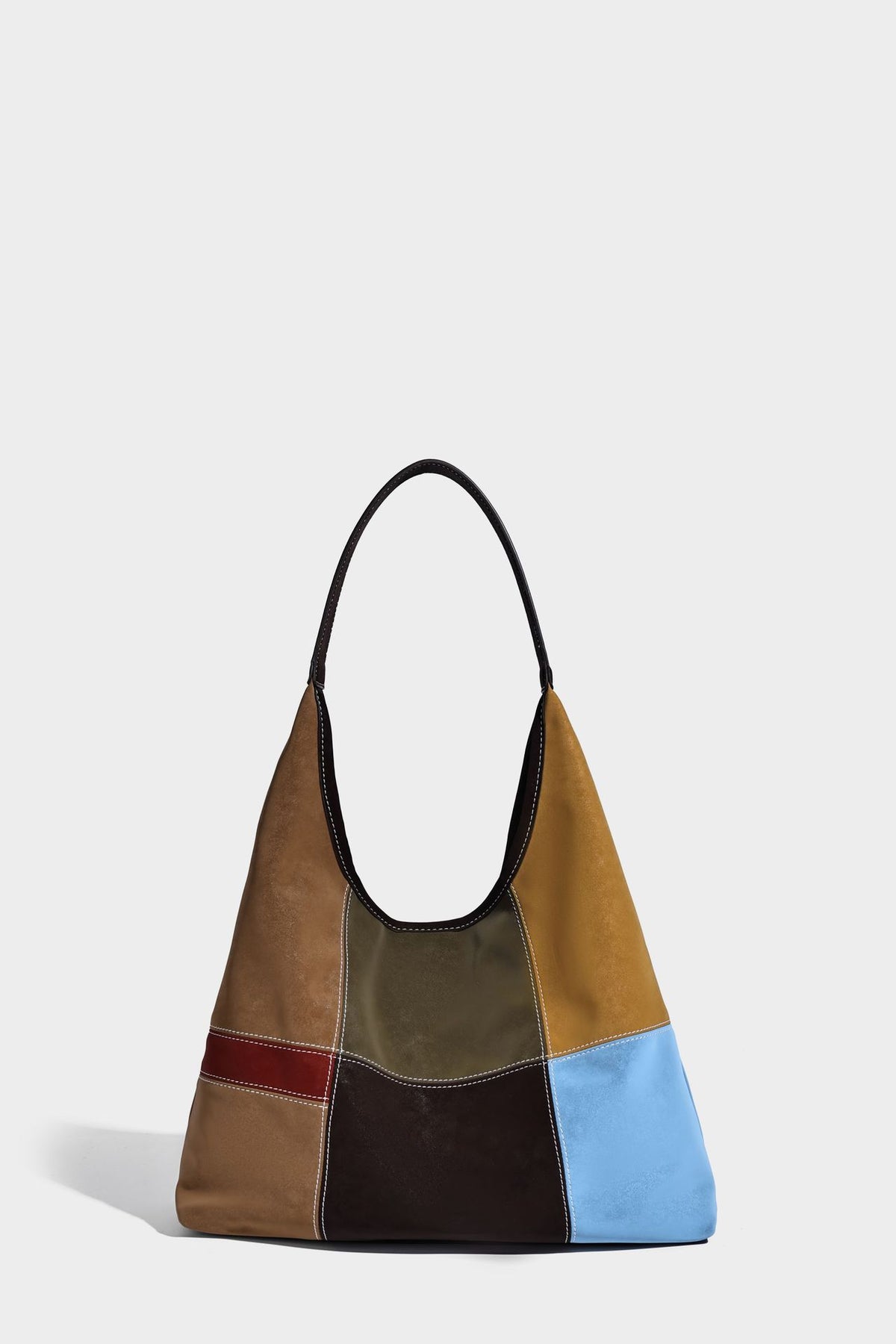 Multicolor patchwork hobo shoulder bag with brown tan olive mustard red and blue suede-look panels, contrast white stitching