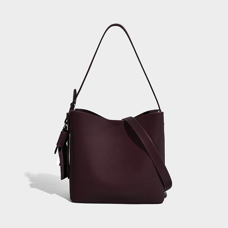 Pebbled leather-look bucket shoulder bag with zip inner pouch and adjustable crossbody strap, detail view 6