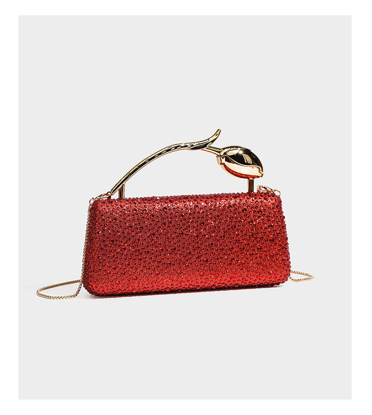 rectangular hard-case rhinestone evening clutch with sculptural gold-tone branch-and-bud top handle and detachable chain