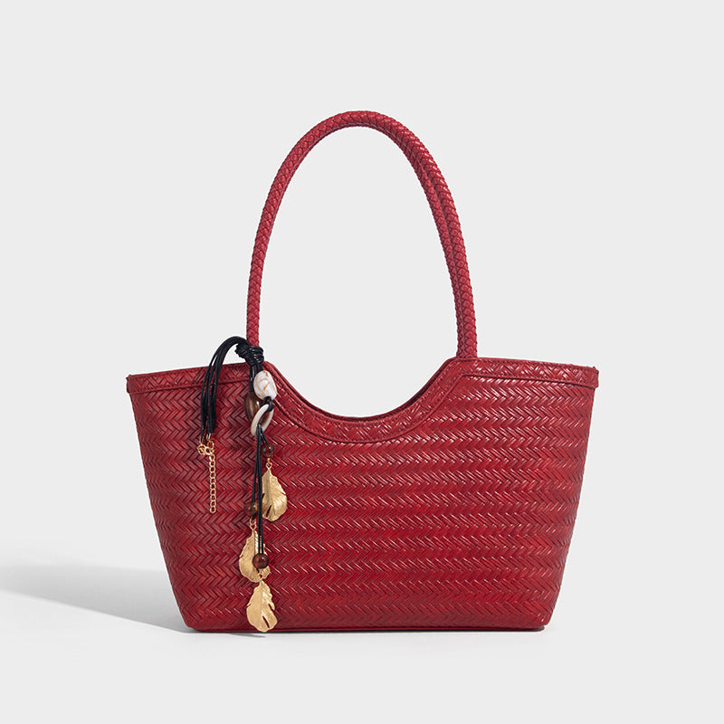 Large open-top woven tote bag with contrasting braided double handles and matching drawstring pouch, detail view 9