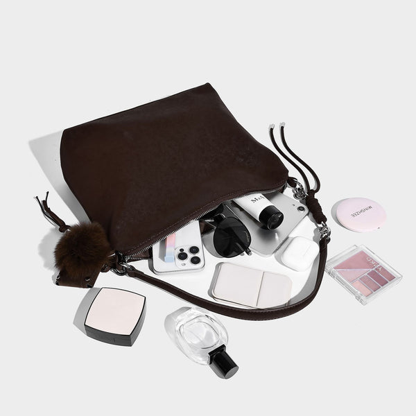 Slouchy matte-finish hobo shoulder bag with tassel cords, silver-tone hardware, and faux-fur pom charm, detail view 4