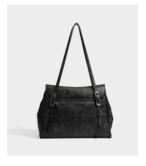 Structured flap-top shoulder tote bag in distressed leather-look finish with silver-tone buckle hardware and double shoulder