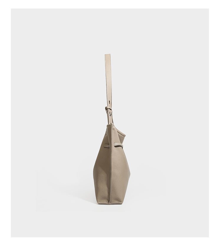 Pebbled leather-look tote bag with front toggle hardware and long shoulder strap, detail view 10