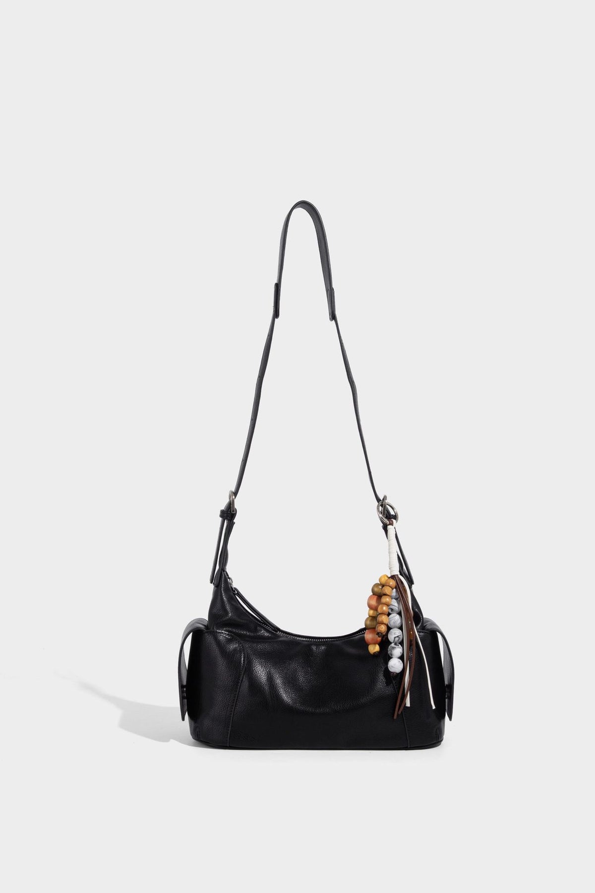 Soft pebbled leather-look hobo shoulder bag with zip top closure, side flap pockets, and silver-tone hardware, detail view 25
