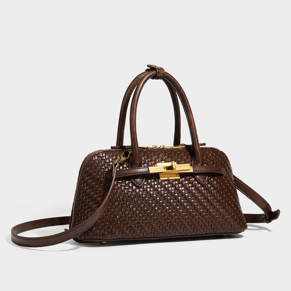 Structured woven-embossed leather-look satchel with dual rolled top handles, gold-tone turn-lock closure, and detachable