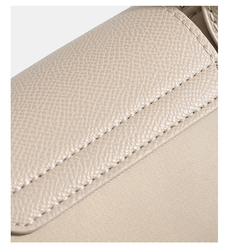 Small structured woven leather-look top-handle bag with gold-tone hardware and detachable crossbody strap, detail view 10