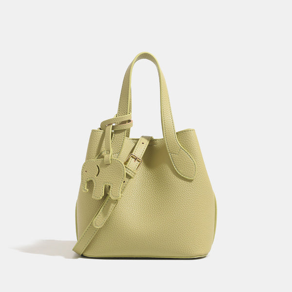 Pebbled leather-look bucket tote with elephant charm pendant, dual top handles, and detachable shoulder strap, detail view 6