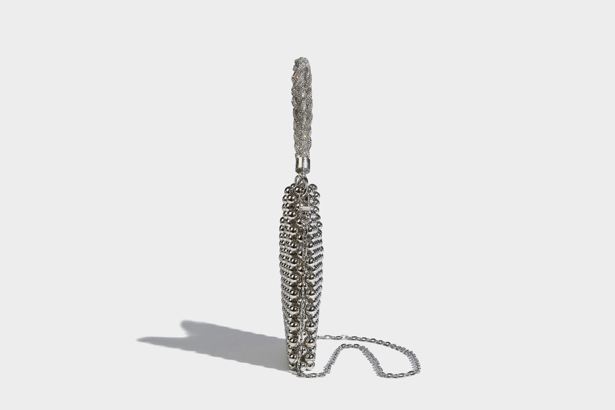 Small silver metallic beaded mini bag with braided rhinestone top handle and detachable chain crossbody strap, detail view 19
