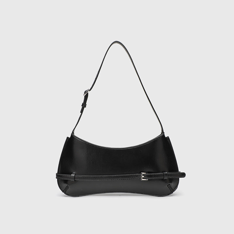 Curved baguette shoulder bag with front buckle strap and adjustable thin strap in glossy leather-look finish, front view