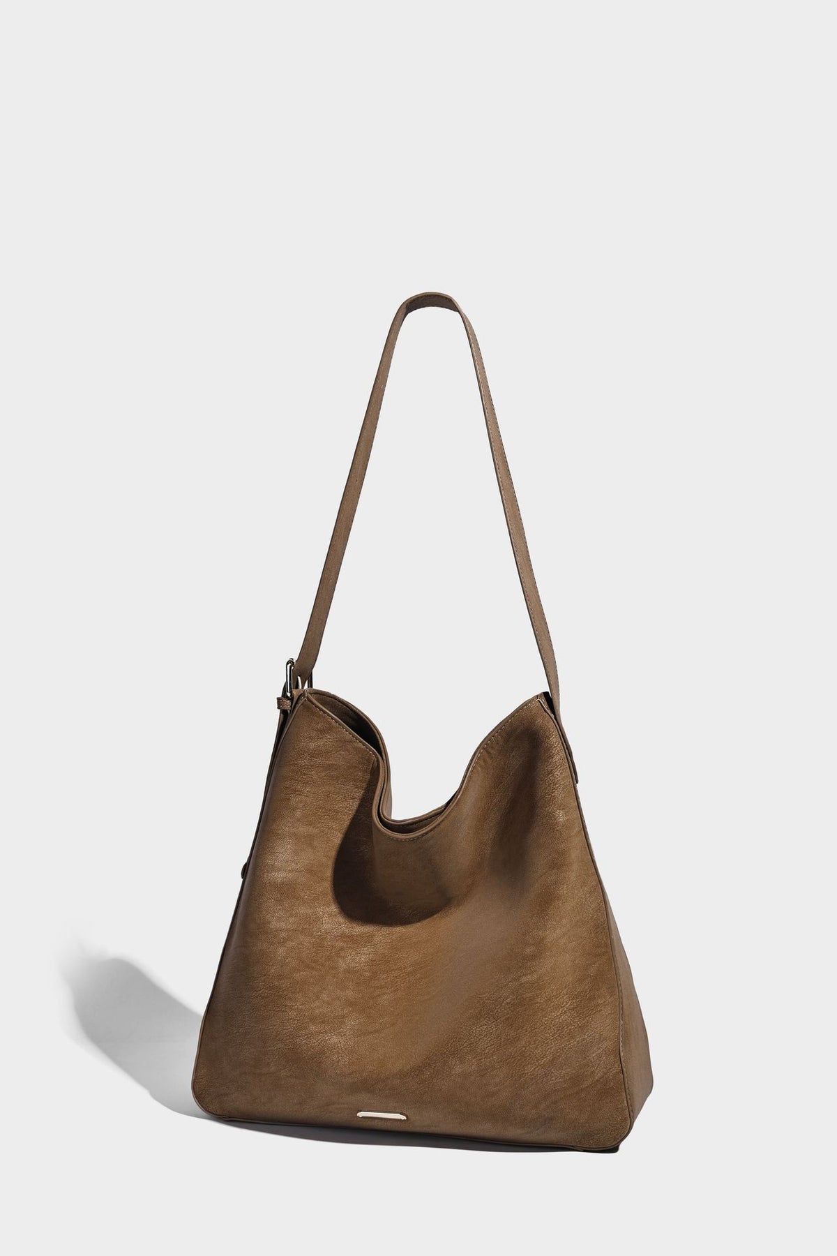 Large slouchy hobo shoulder bag in matte leather-look finish with adjustable strap and gold-tone bar hardware, detail view 14