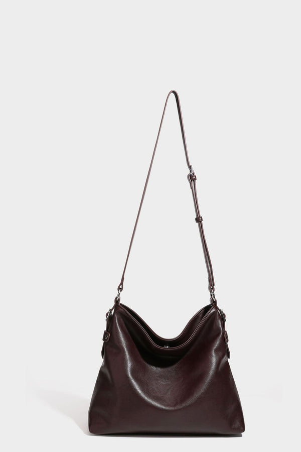 Large slouchy hobo shoulder bag in dark brown with smooth leather-look finish, adjustable strap, and silver-tone hardware