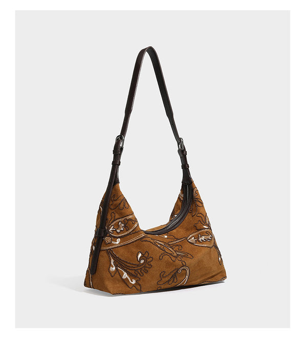 Deep chocolate suede-look hobo shoulder bag with tonal paisley floral embroidery, smooth dark leather-look trim, top zip
