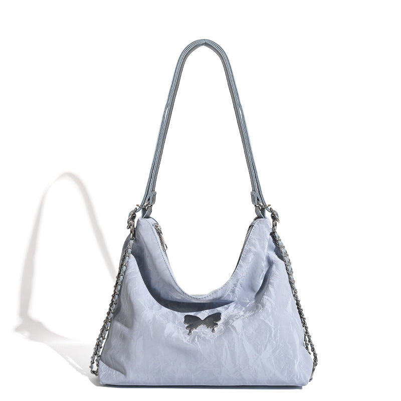 Crinkle-finish hobo shoulder bag with silver-tone chain side panels and butterfly embellishment, detail view 5