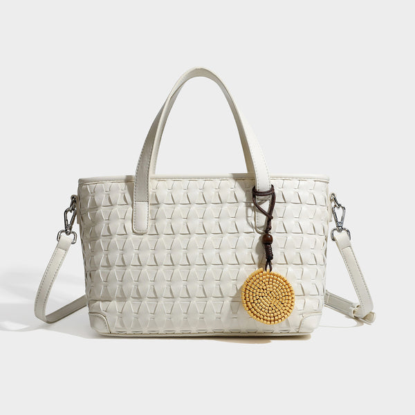 Strukturierte Tote-Bag in dunkelbrauner Lederoptik mit Webstruktur, zwei Tragegriffen, abnehmbarem Crossbody-Riemen und runde