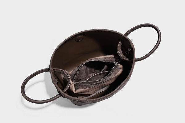 Small structured matte pebbled tote bag with twin top handles and removable zip pouch, detail view 26