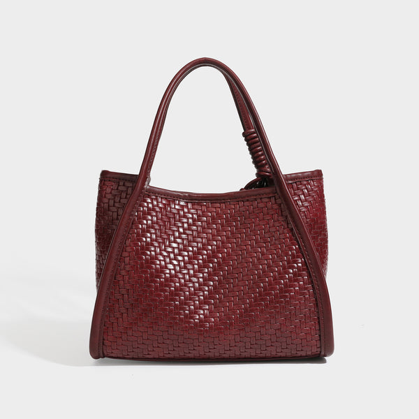 Strukturierte Tote Bag mit Webstruktur in Braun, glatten Besätzen in Lederoptik, geknoteten Tragegriffen und befestigtem Mini-Beutel mit Kordelzug