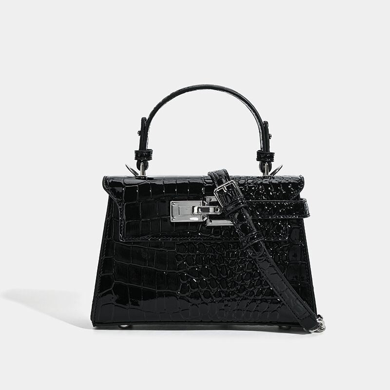 Croc-embossed mini top-handle satchel with silver turn-lock closure and adjustable crossbody strap, detail view 7
