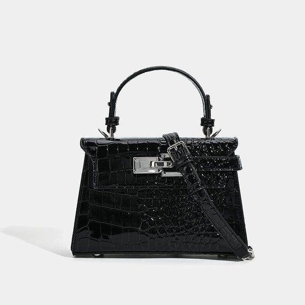 Croc-embossed mini top-handle satchel with silver turn-lock closure and adjustable crossbody strap, detail view 7