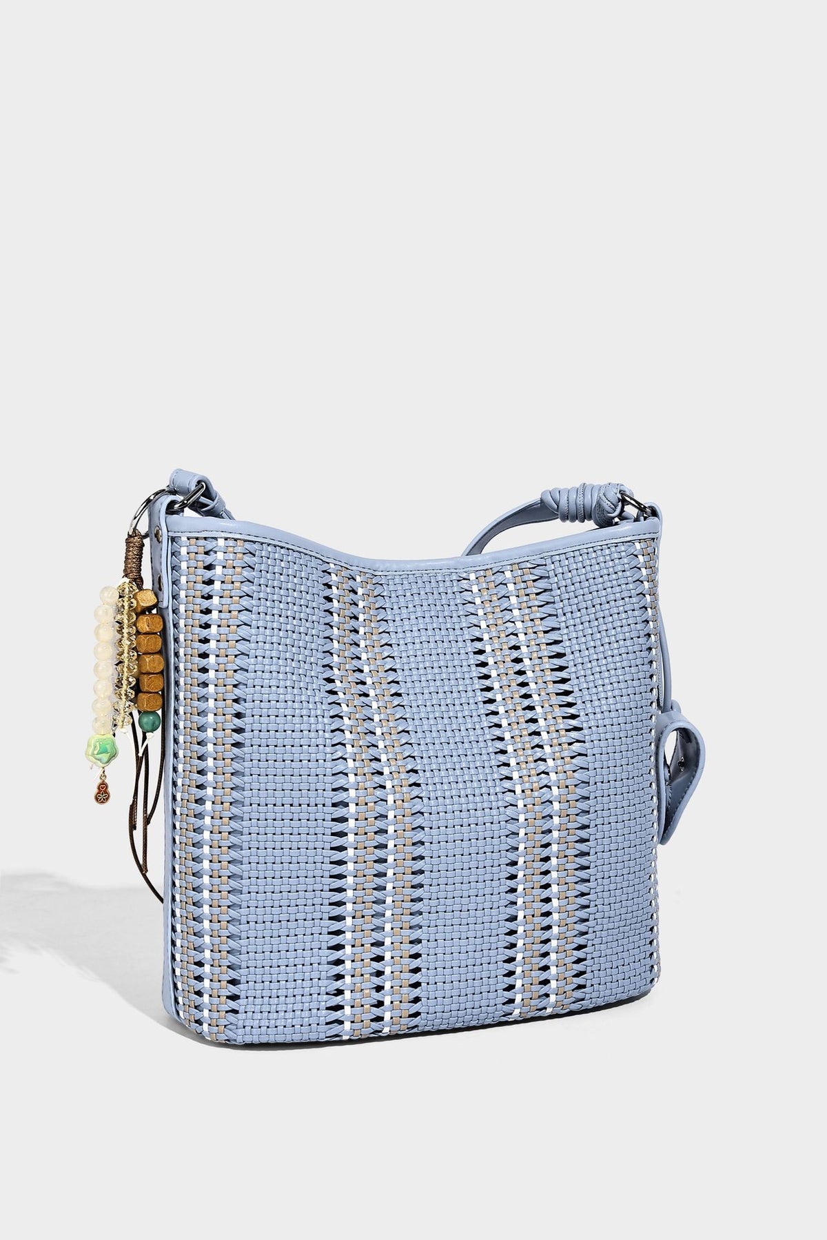 Woven bucket shoulder bag with leather-look trim, silver-tone hardware, and beaded tassel charm, detail view 33
