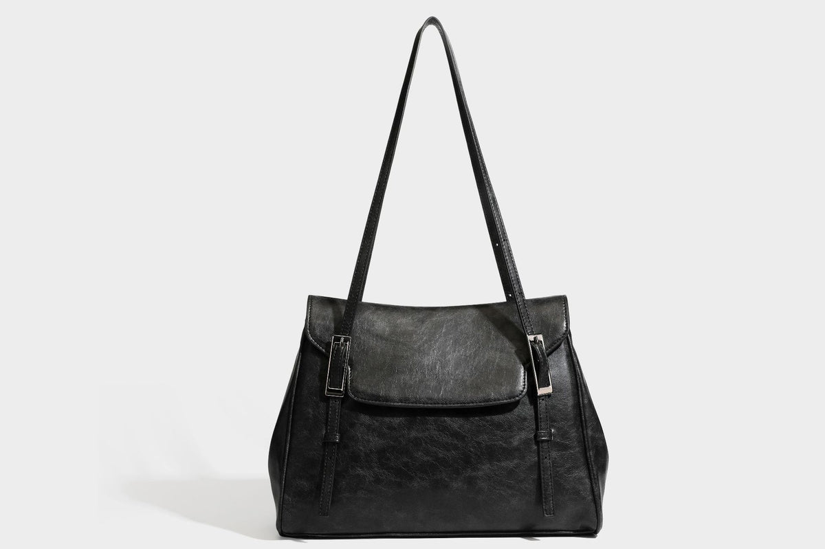 Structured flap-top shoulder tote bag in distressed leather-look finish with silver-tone buckle hardware and double shoulder