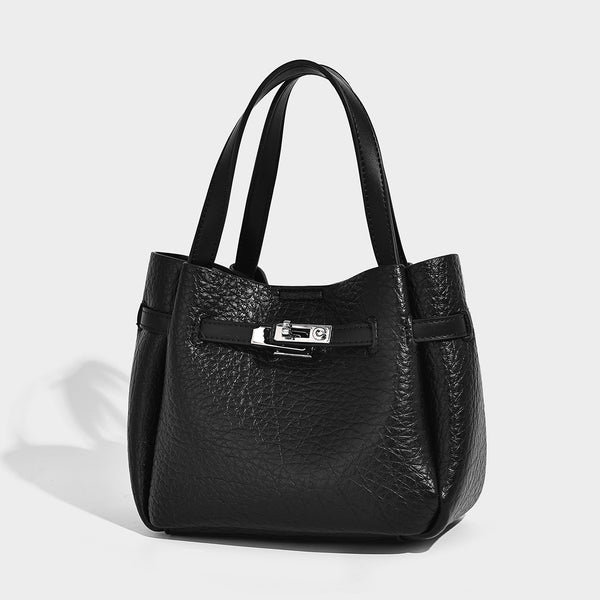 Small structured pebbled bucket tote with double top handles, silver turn-lock hardware, and detachable shoulder strap