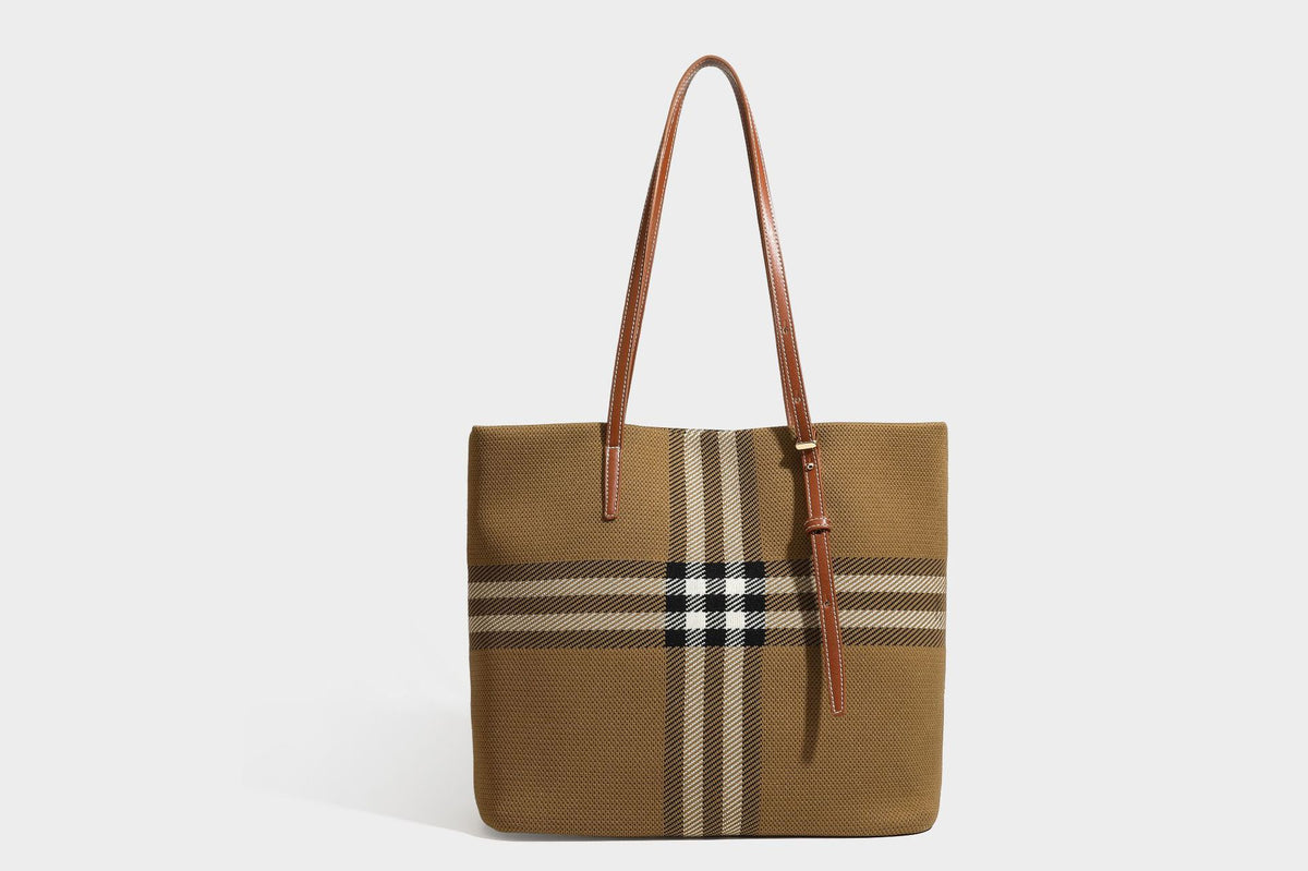 Large structured plaid check tote bag with smooth tan leather-look shoulder straps, attached front zip pouch, and gold-tone
