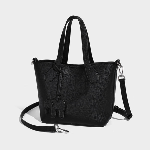 Compact pebbled bucket tote bag with elephant charm, twin top handles, and detachable crossbody strap, detail view 6