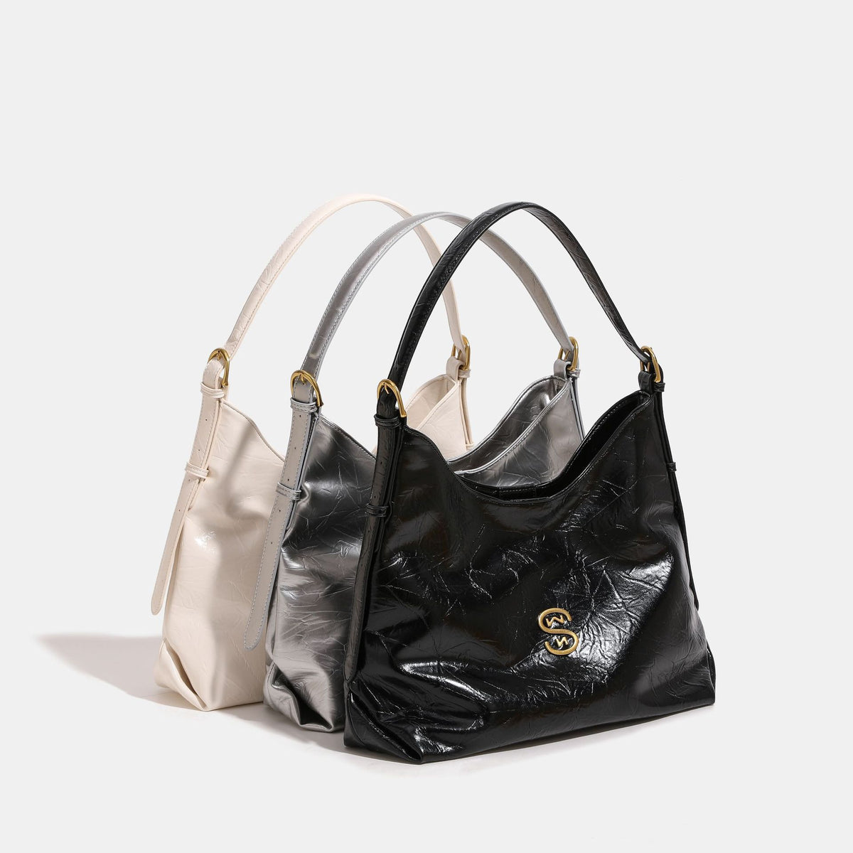 Glossy crinkled hobo shoulder bag with gold-tone logo hardware and adjustable strap, front view
