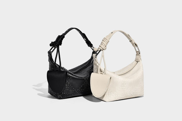 Small embossed half-moon shoulder bag with top zipper, detachable front pouch, and adjustable slim strap, detail view 8