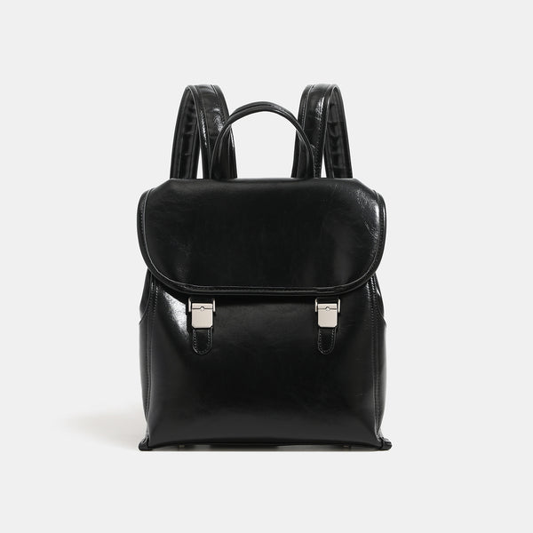 Structured glossy leather-look flap backpack with twin buckle closures and top grab handle, detail view 6