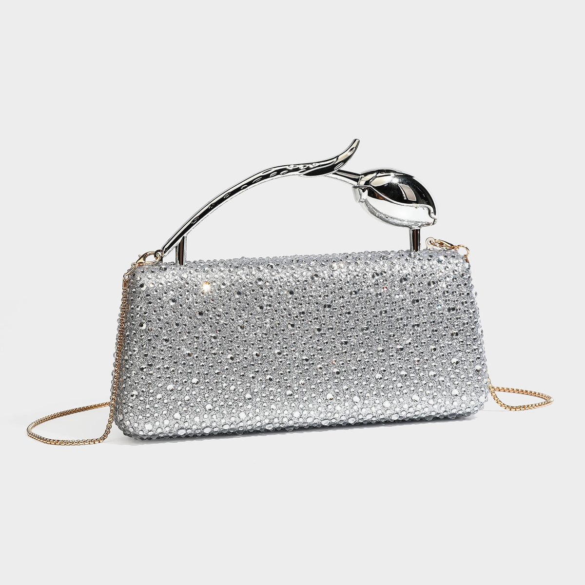 rectangular hard-case rhinestone evening clutch with sculptural gold-tone branch-and-bud top handle and detachable chain