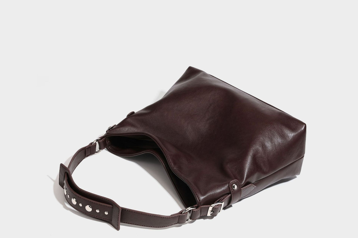 Large slouchy hobo shoulder bag in dark brown with smooth leather-look finish, adjustable strap, and silver-tone hardware