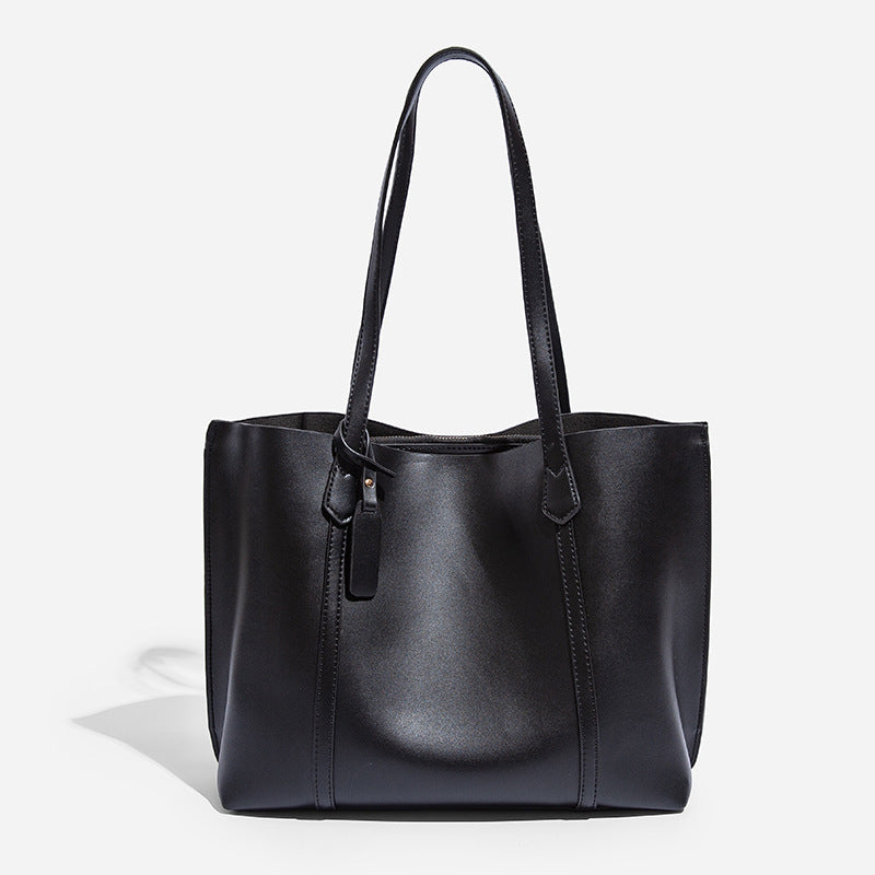 Large structured leather-look tote bag with belt-strap detail and gold-tone hardware, detail view 7