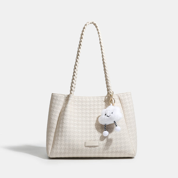 Structured geometric-embossed tote bag with braided shoulder straps and gold-tone hardware in ivory, detail view 7