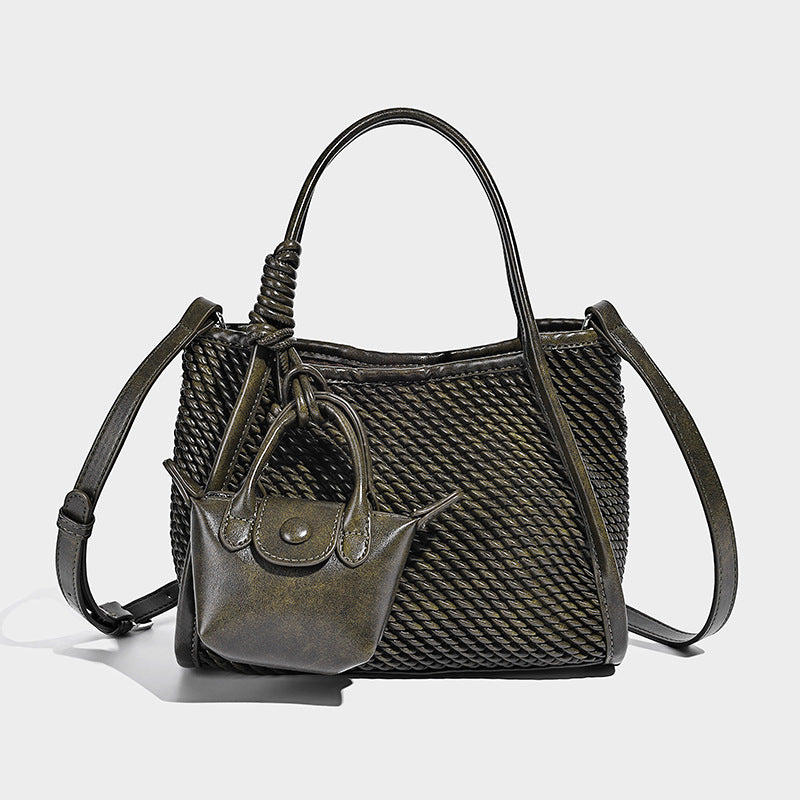 Large structured woven rope-texture tote bag with smooth leather-look trim, knotted dual top handles, detachable mini front