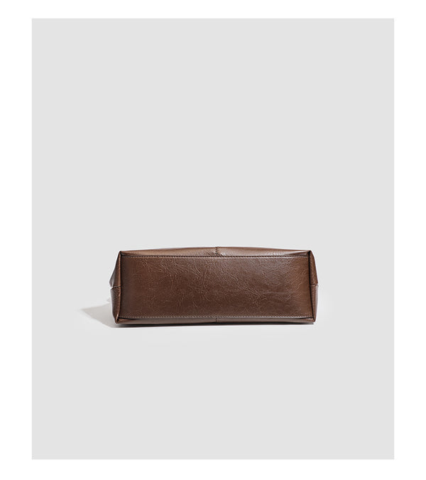 Large slouchy hobo shoulder bag in smooth leather-look finish with adjustable strap and gold-tone hardware, detail view 16