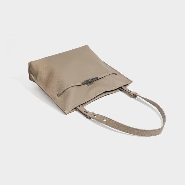 Large structured tote bag in pebbled leather-look finish with silver-tone twist-knot front detail and adjustable shoulder