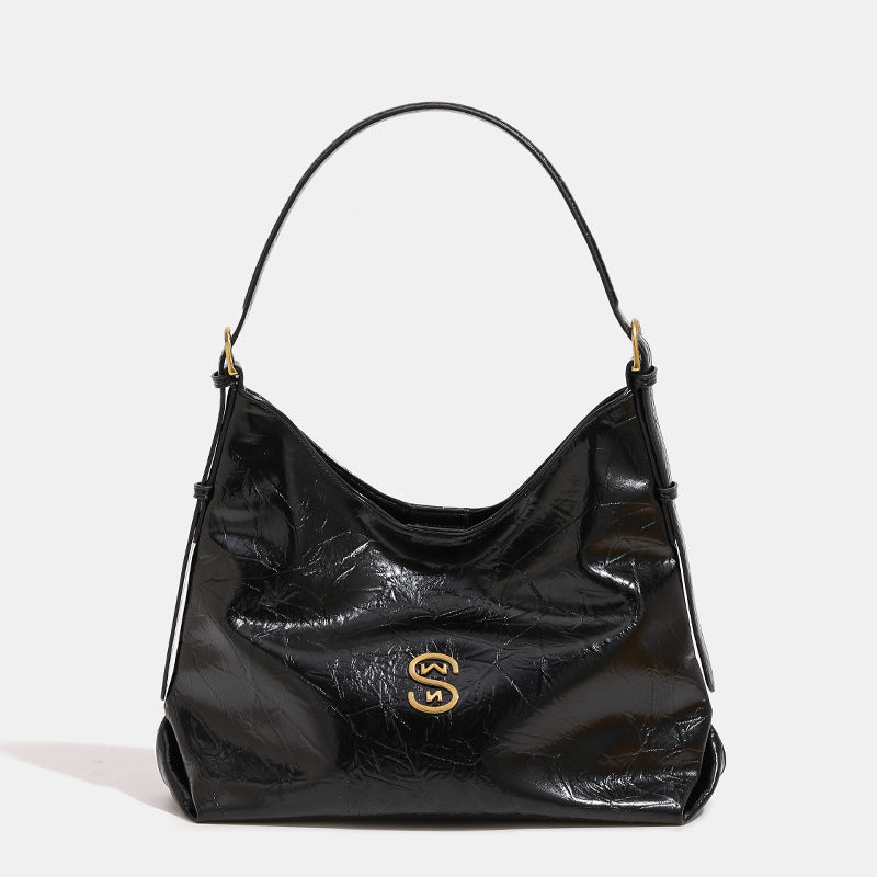 Glossy crinkled hobo shoulder bag with gold-tone logo hardware and adjustable strap, detail view 6