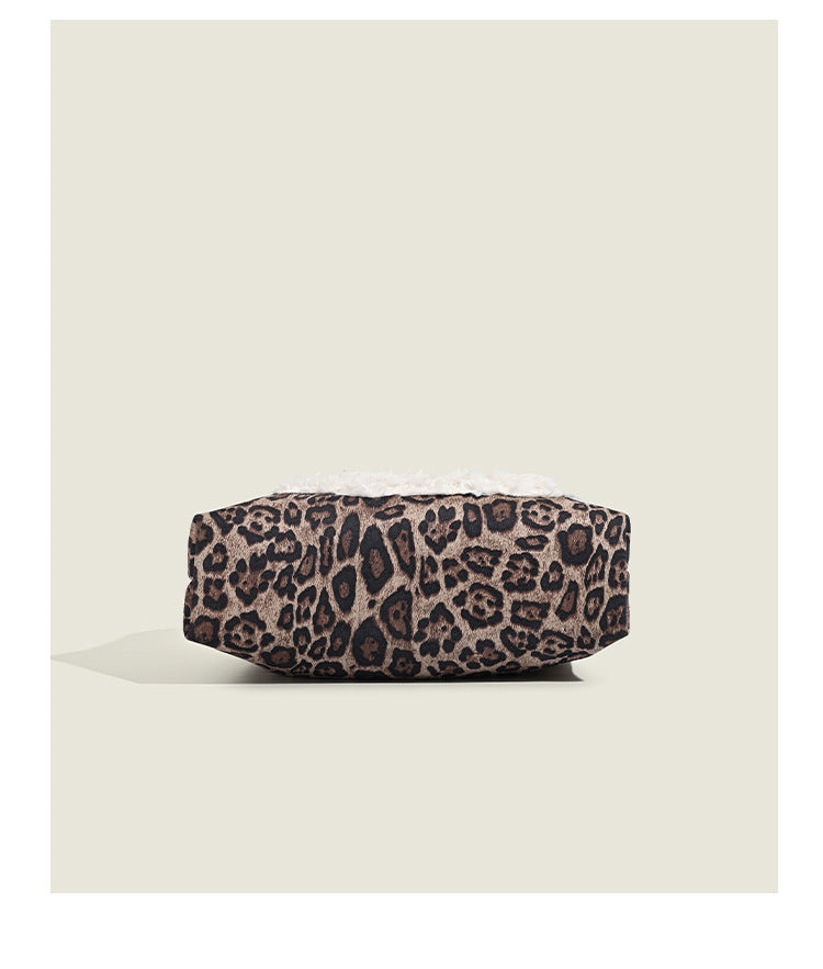 Leopard-print fabric tote bag with white plush teddy bear appliqué and brown leather-look shoulder straps, detail view 13