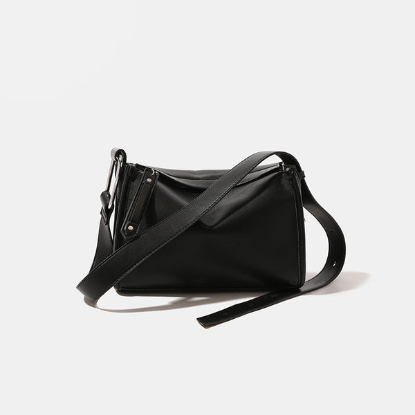 Structured smooth leather-look shoulder bag with top zip closure, tassel pull, and adjustable crossbody strap in khaki
