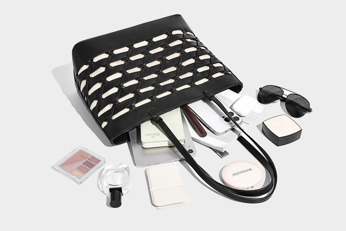 Structured woven lattice cutout tote bag with smooth leather-look trim, dual shoulder straps, and silver-tone hardware