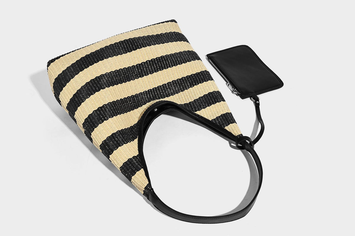 Black and beige striped woven shoulder tote bag with leather-look trim and detachable black zip pouch, detail view 14