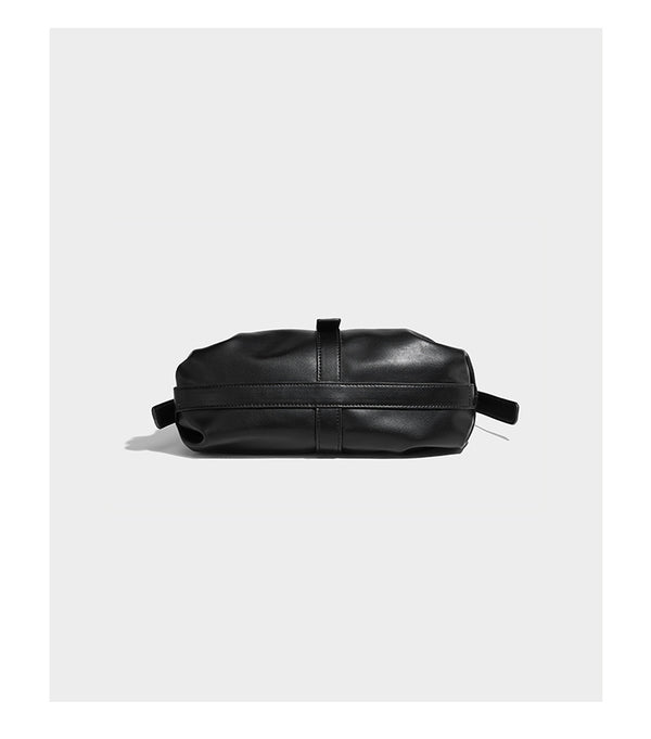 Soft slouchy hobo shoulder bag with smooth leather-look finish, gold-tone buckle and tab hardware, and long adjustable strap