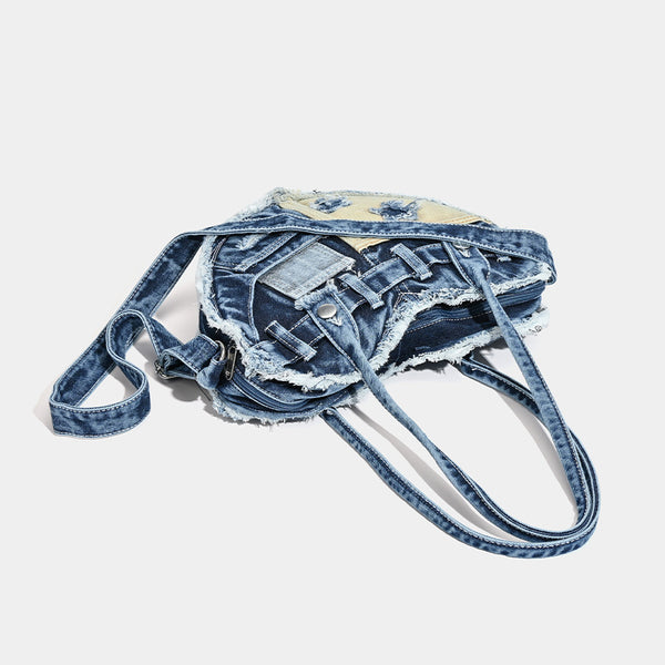 Heart-shaped patchwork washed denim shoulder bag with frayed edges, front patch pockets, and metal hardware, detail view 4