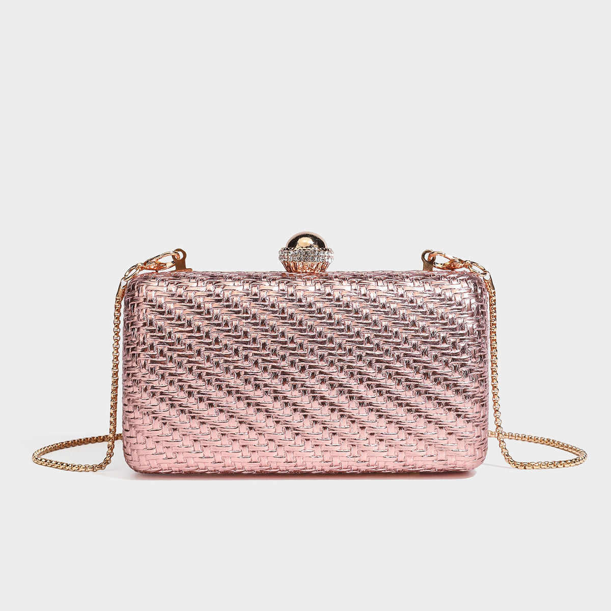 Small structured metallic woven-texture box clutch bag with jeweled kiss-lock dome clasp and slim gold chain strap, detail
