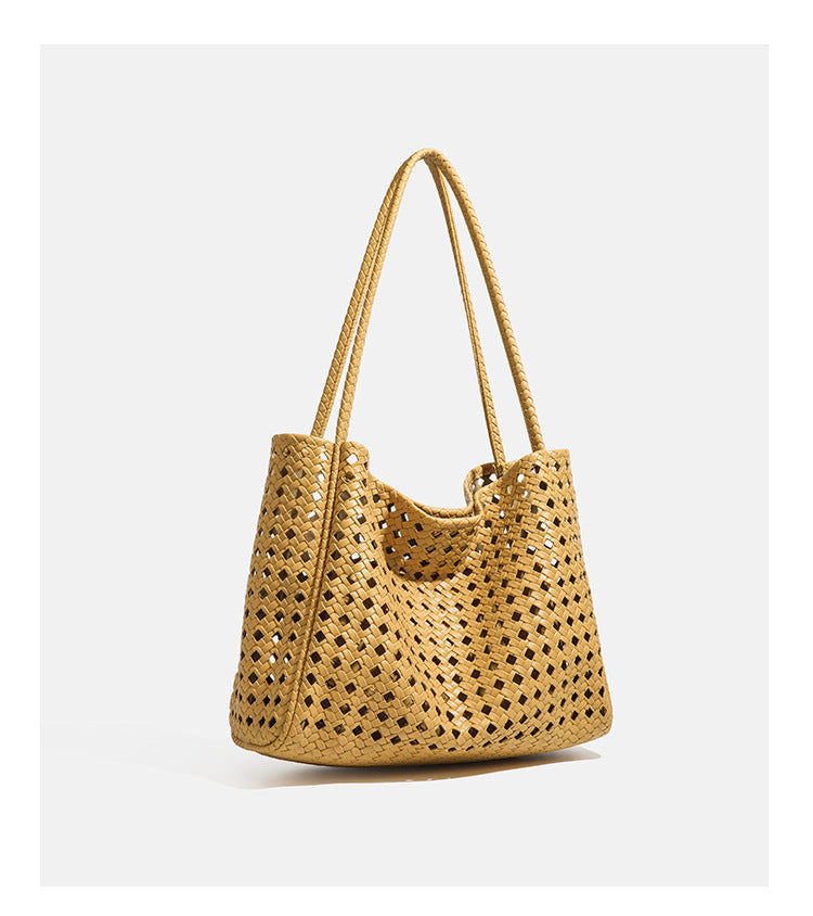 Slouchy open-lattice woven shoulder tote bag with long braided straps and matching zip pouch, detail view 16